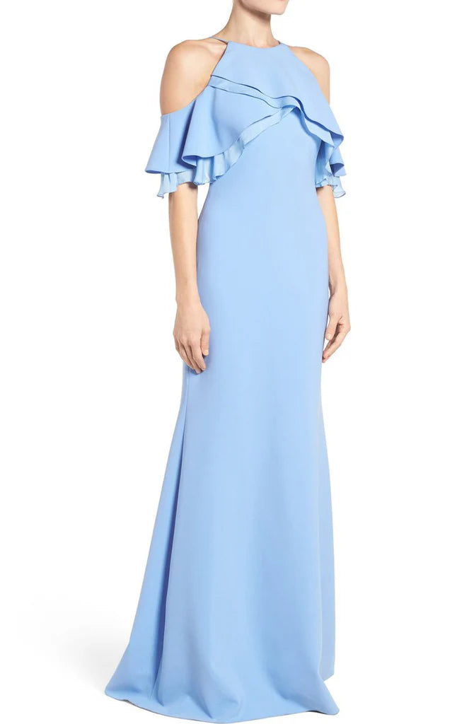 Woman wearing an elegant off-shoulder sheath long prom dress.