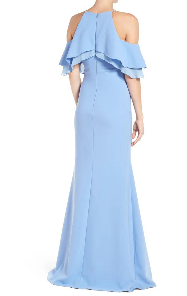Back view of a woman in a formal off-shoulder long gown.