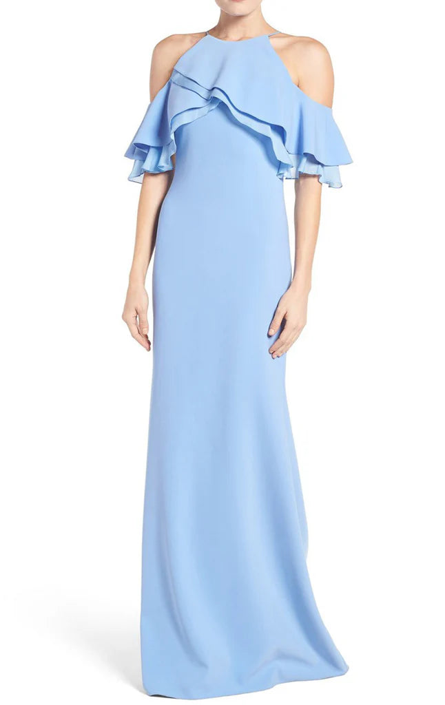 Side view of the off-shoulder sheath dress with a flowing skirt.