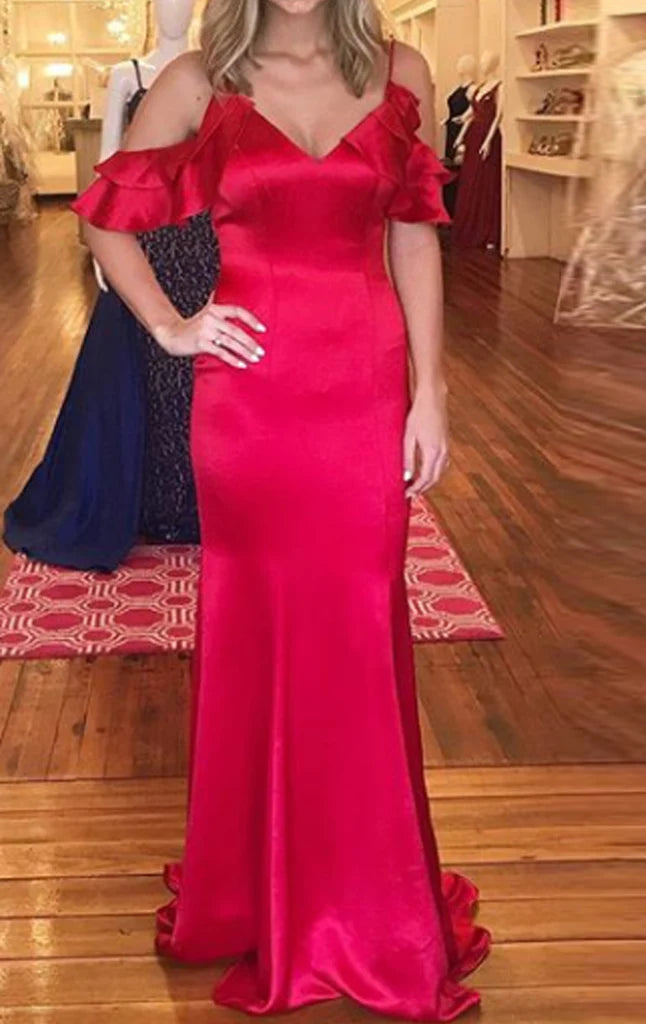 Woman wearing an elegant off-shoulder satin sheath prom dress.