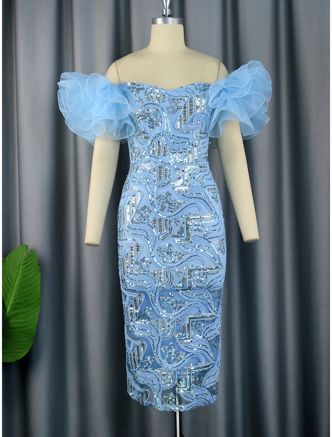 Elegant sequined floral tea length party dress.