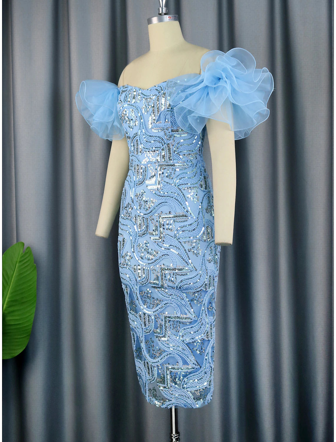 Side view of the sequined floral cocktail dress.