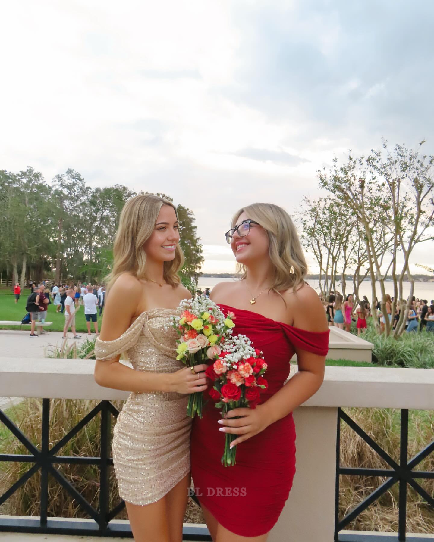 Side view of model in a chic off-shoulder short sheath dress.