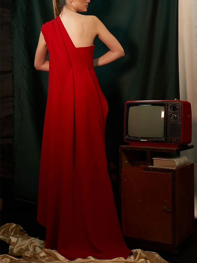 Back view of a woman in a sleeveless formal gown.