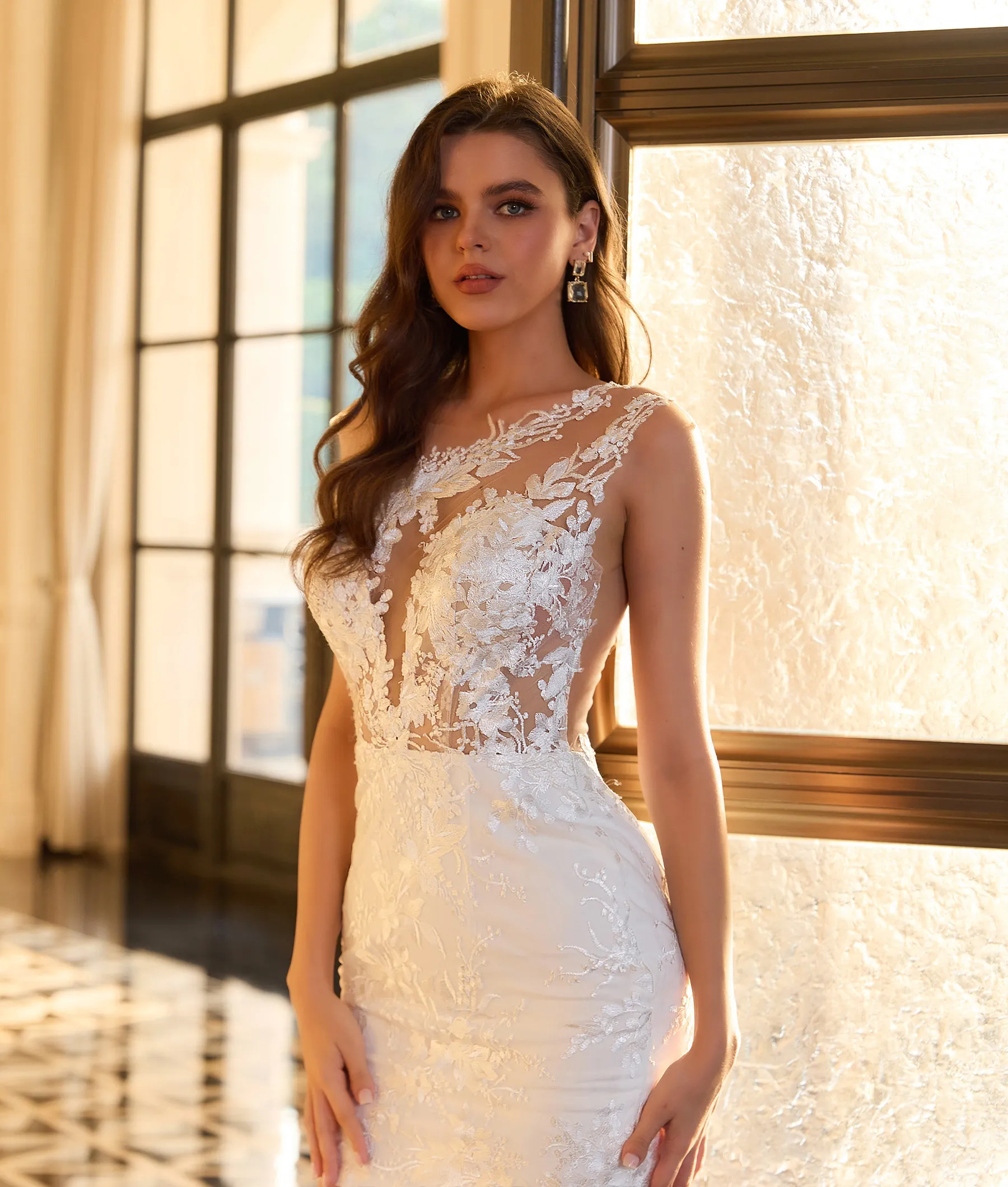 Elegant one-shoulder sheath dress with lace appliques.