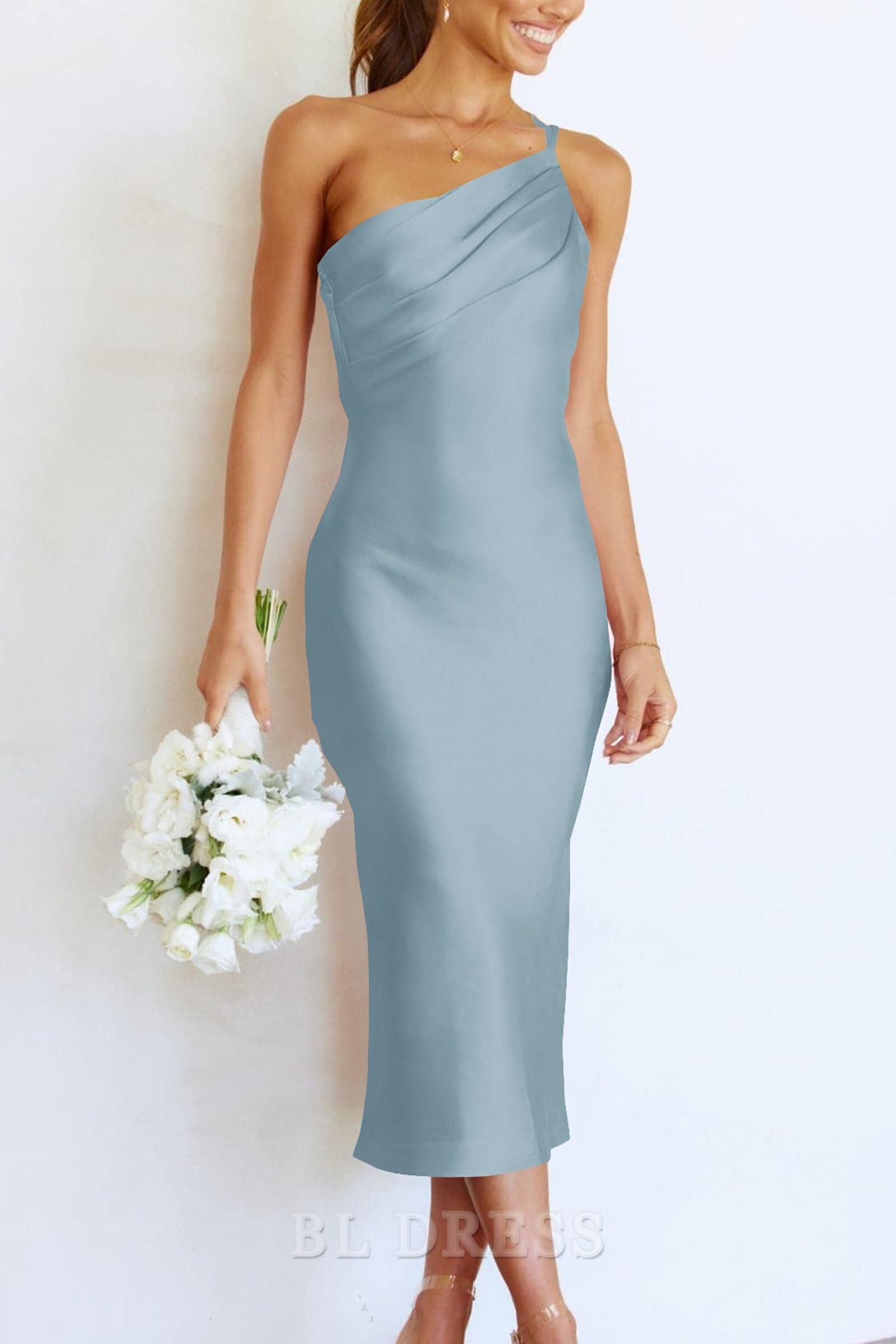 Back view of a woman wearing a sheath satin formal dress.