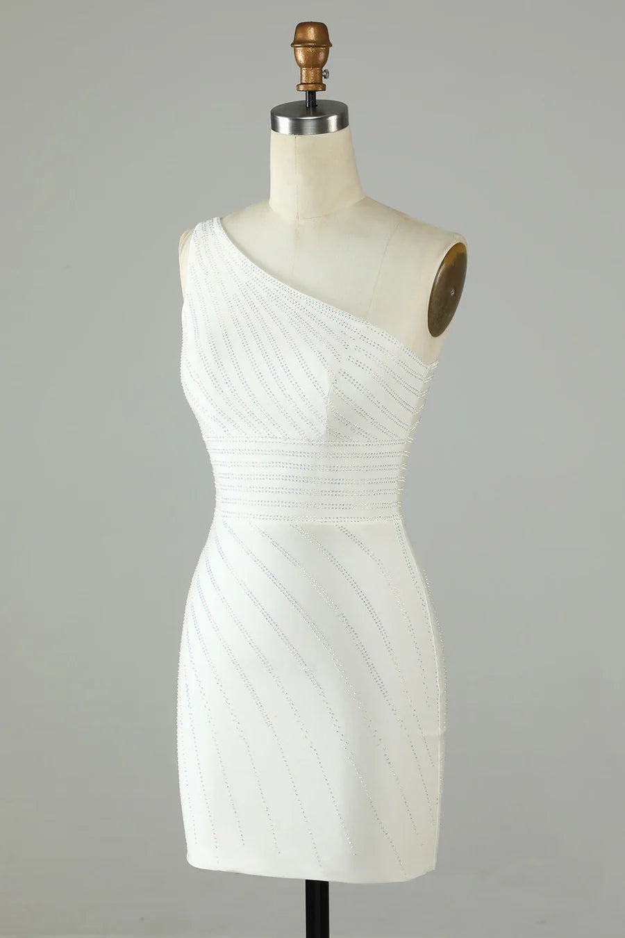 Close-up of the intricate beaded embellishments on the one-shoulder dress.