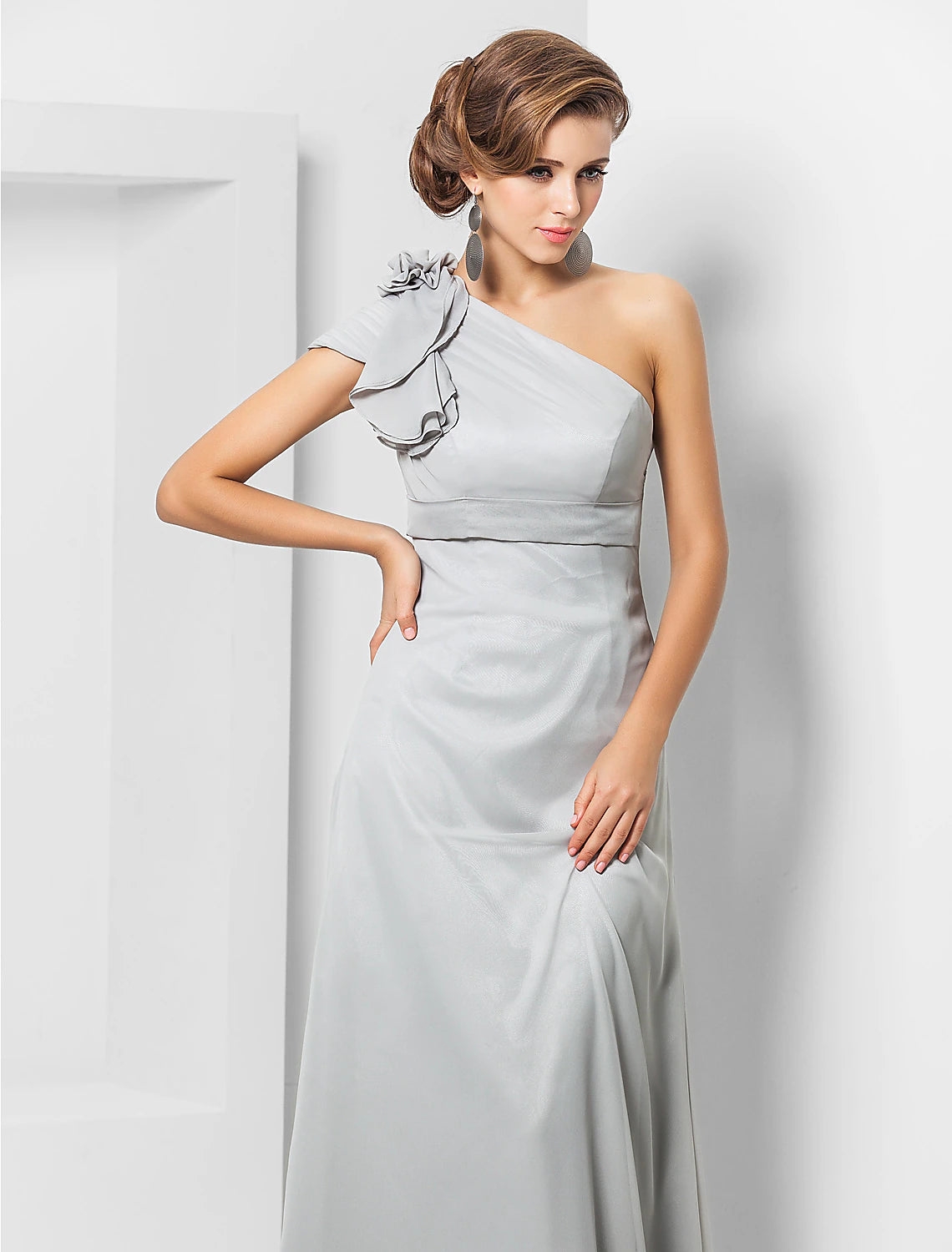 Full view of a woman wearing a sophisticated formal evening gown.