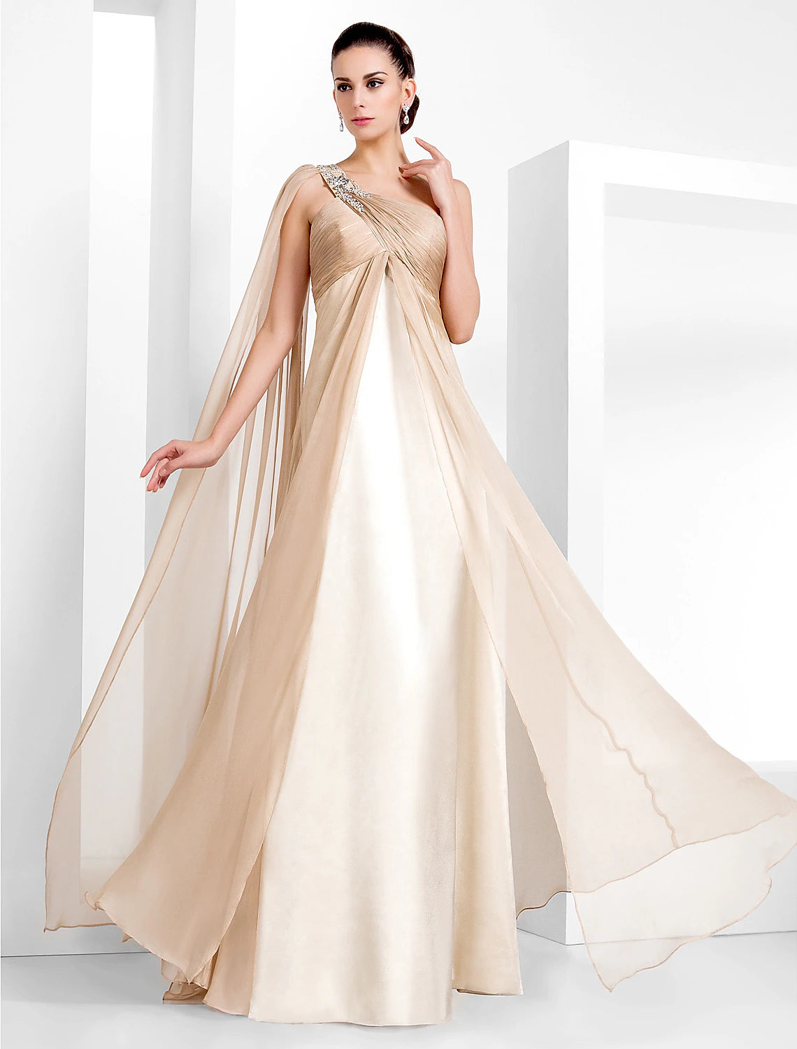 Elegant one-shoulder black chiffon gown with criss-cross crystal embellishments.