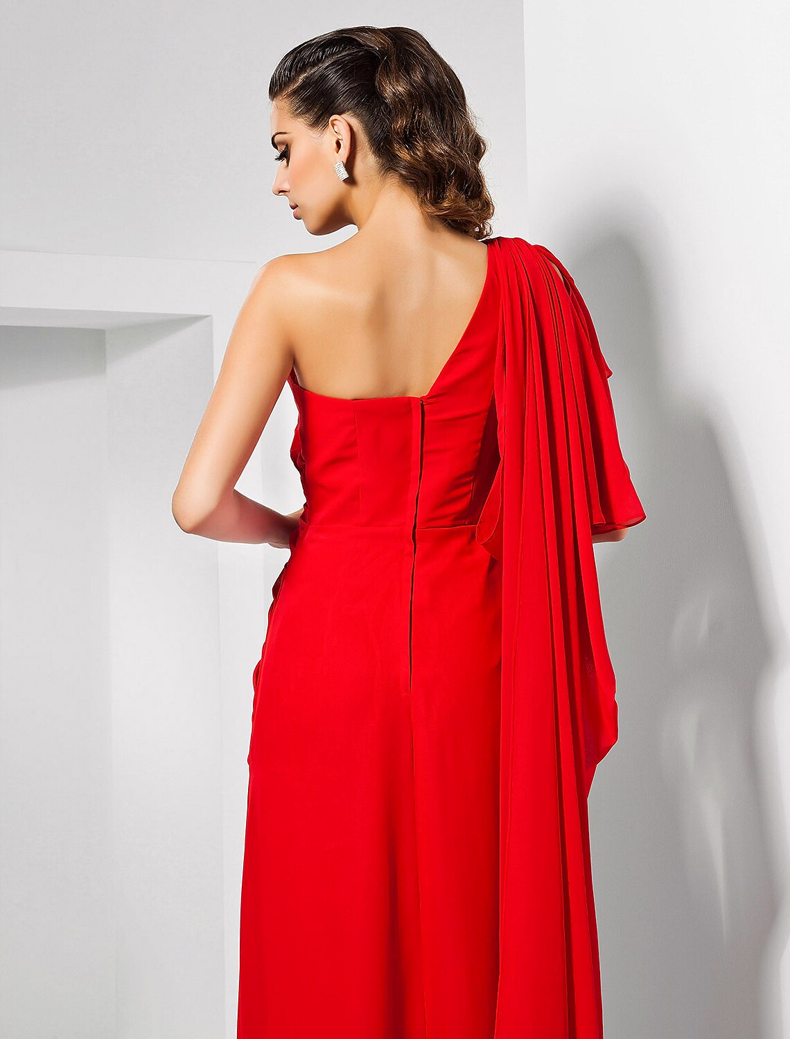 Model posing in a red formal dress, showcasing the elegant silhouette.