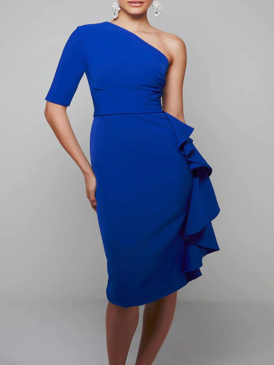 Woman wearing an elegant dark one-shoulder knee-length sheath dress.