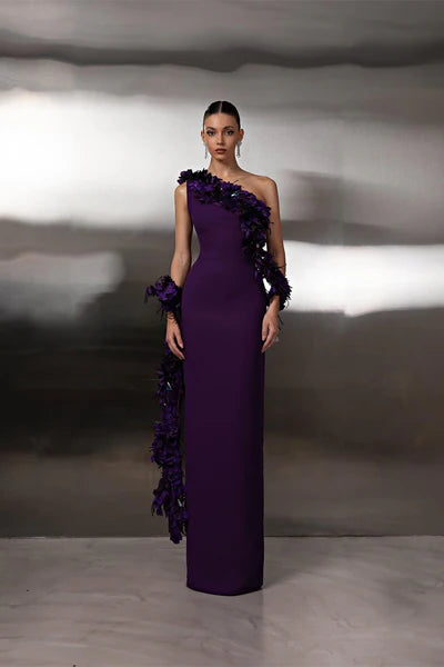 Elegant purple one-shoulder satin prom dress with a delicate flower detail.