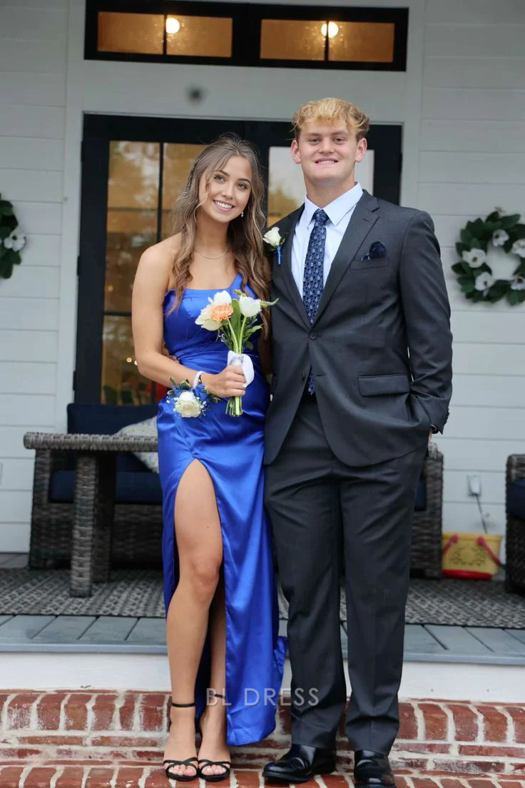 Model posing in a royal blue one-shoulder formal evening dress.