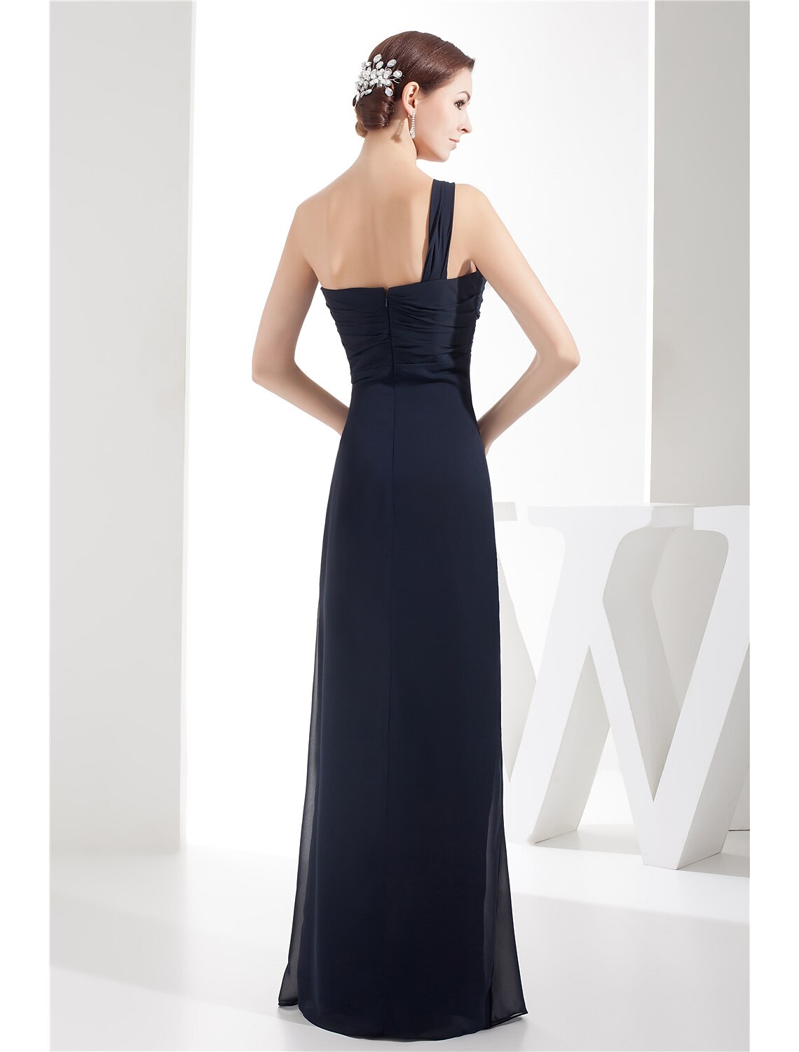 Back view of the ruched sheath gown.