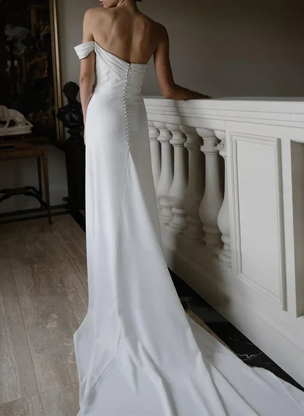 Side view of a one-shoulder satin wedding dress, highlighting the sleek silhouette.