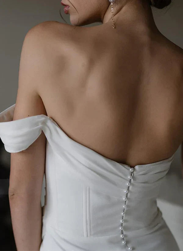 Back view of a sleeveless satin wedding dress, showcasing the smooth fabric.