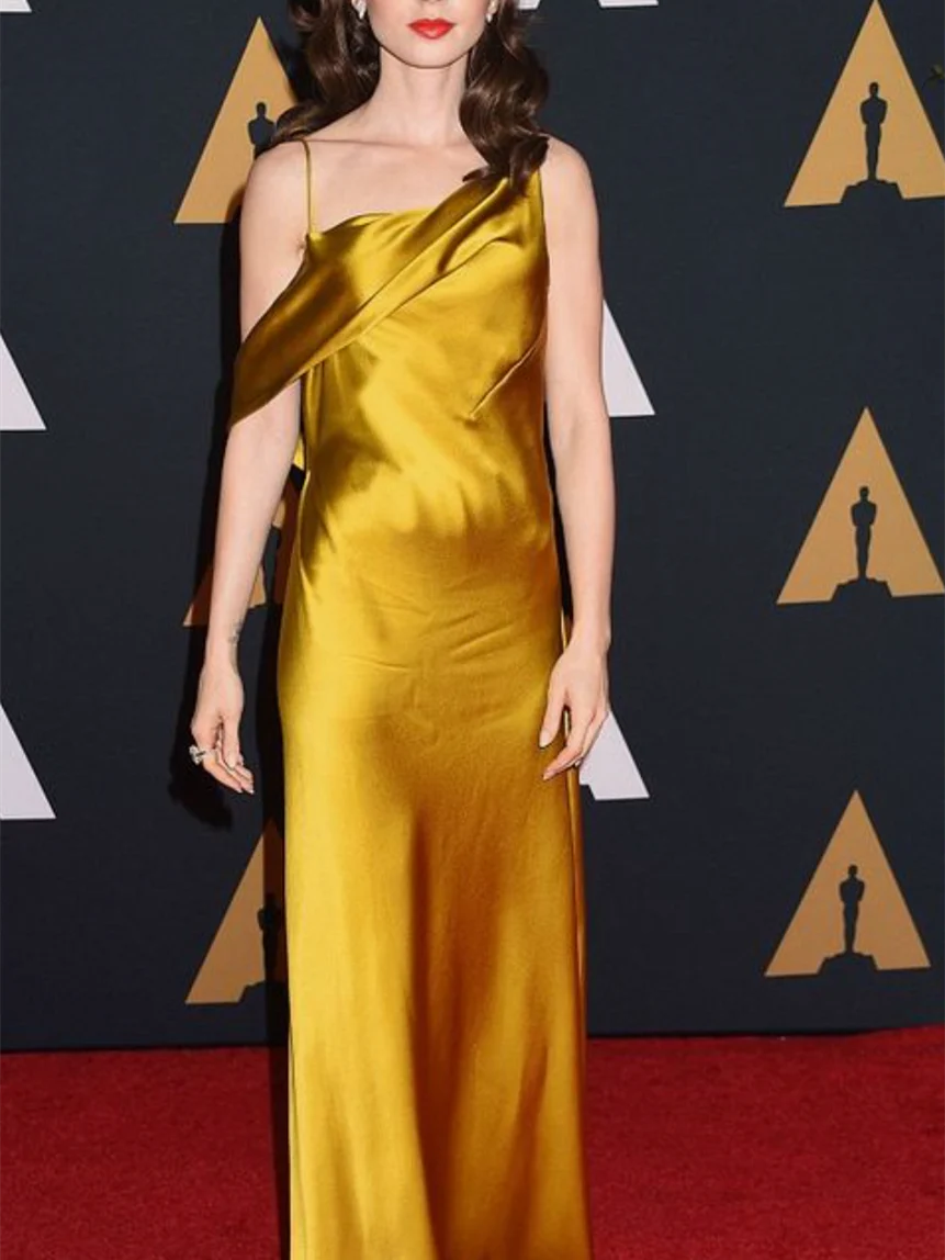 Back view of the sleeveless sheath evening dress, highlighting the open back design.