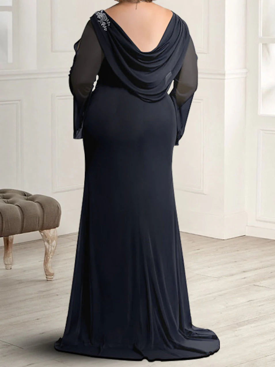 Formal sleeveless maxi dress with a round neck, suitable for weddings.