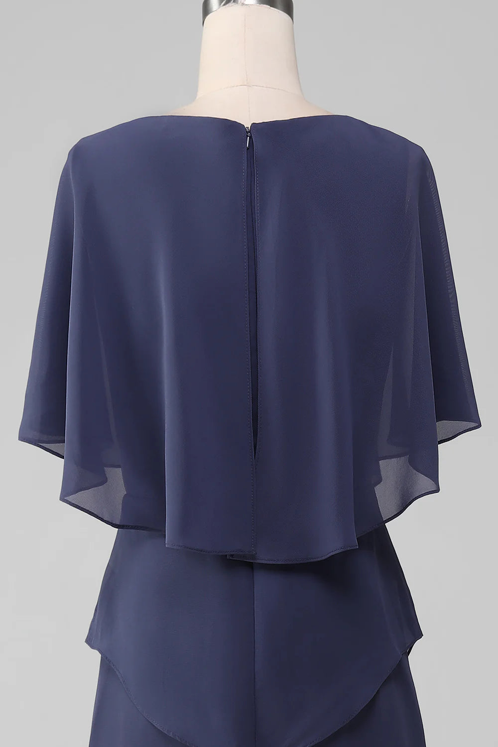 Close-up of stormy blue chiffon fabric and scoop neckline.