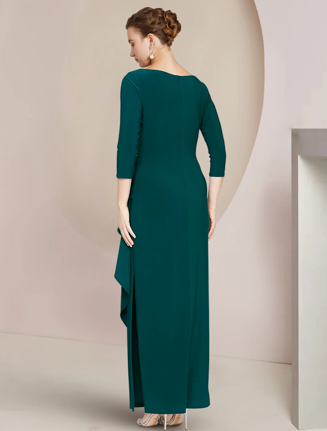 Back view of a woman wearing a formal sheath gown, highlighting the ankle length and elegant silhouette.