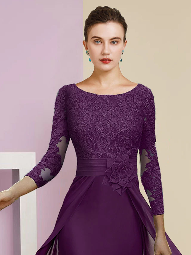 Close-up of the lace appliques and 3/4 sleeves on the elegant sheath dress.