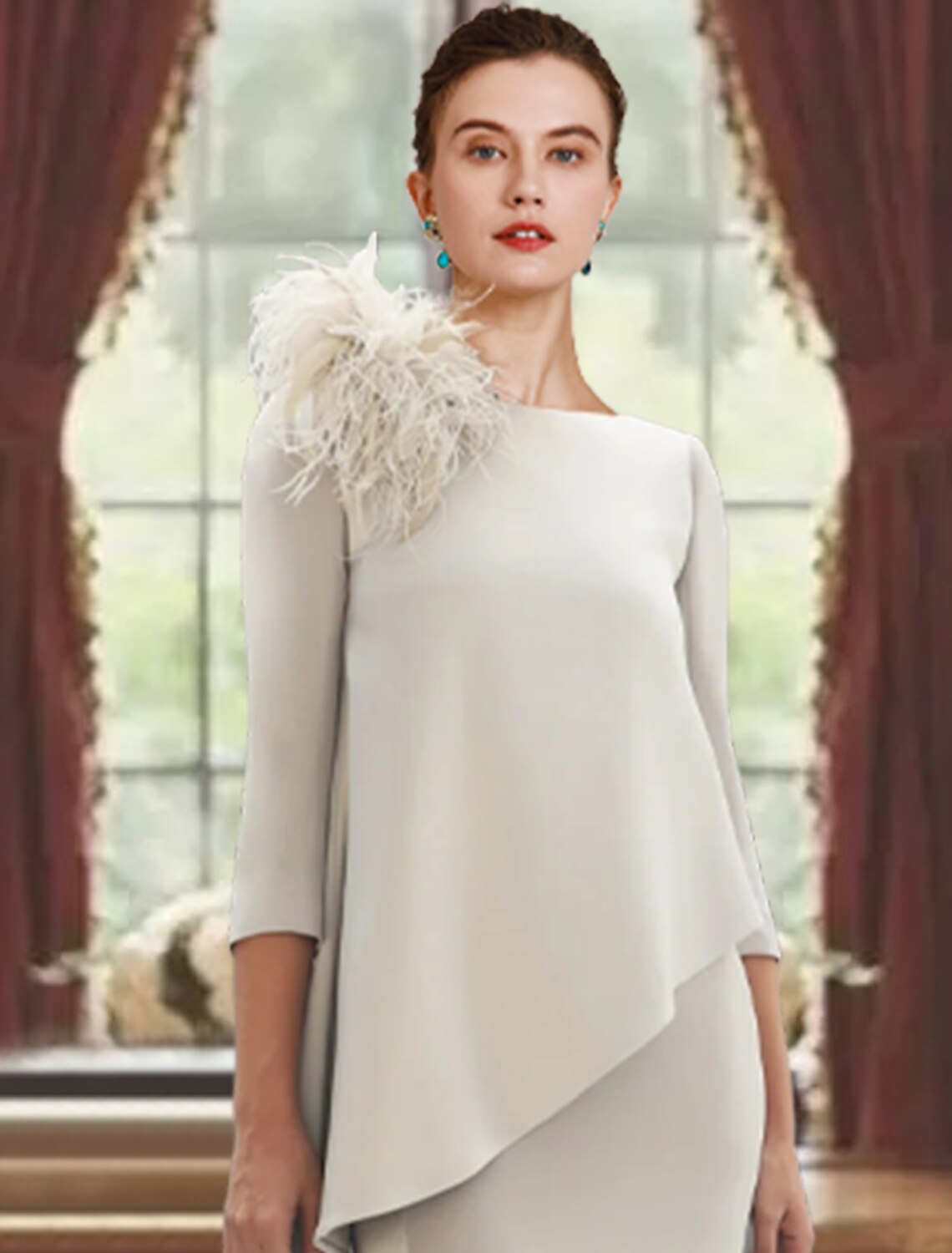 Close-up of the feather detail on the 3/4 length sleeve of the dress.