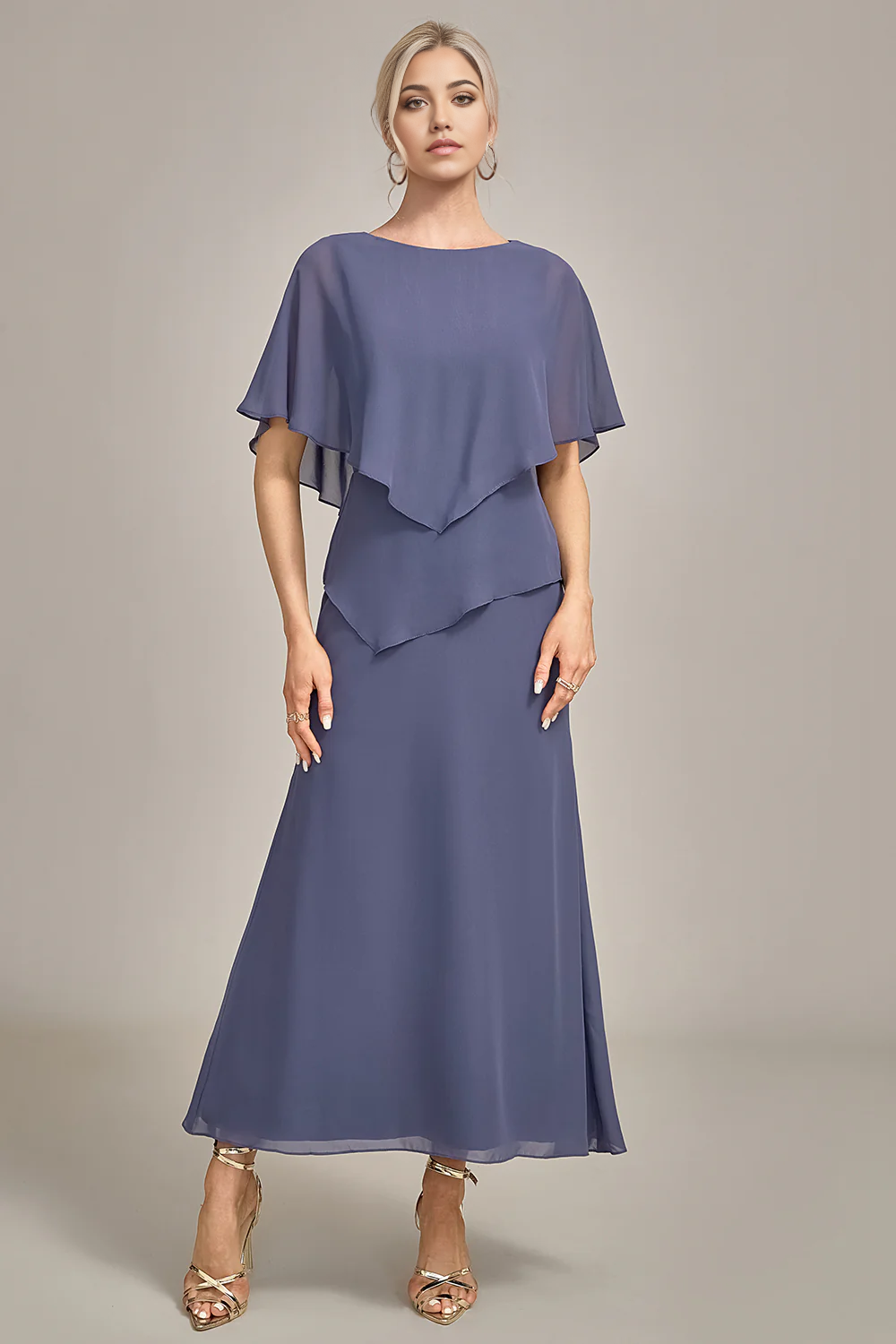 Woman in elegant tea-length chiffon sheath dress with scoop neck.