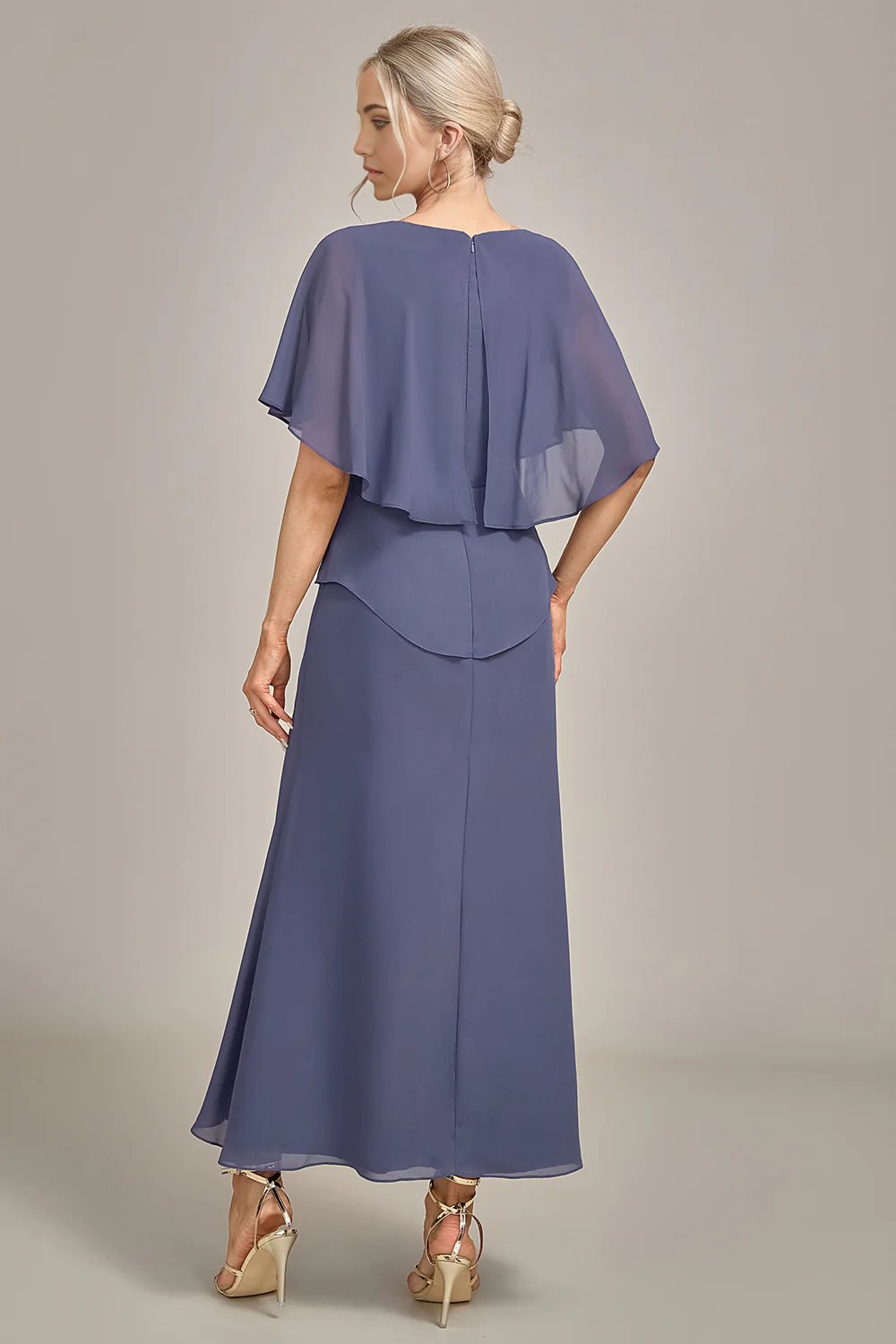 Back view of woman in tea-length chiffon Mother of the Bride dress.