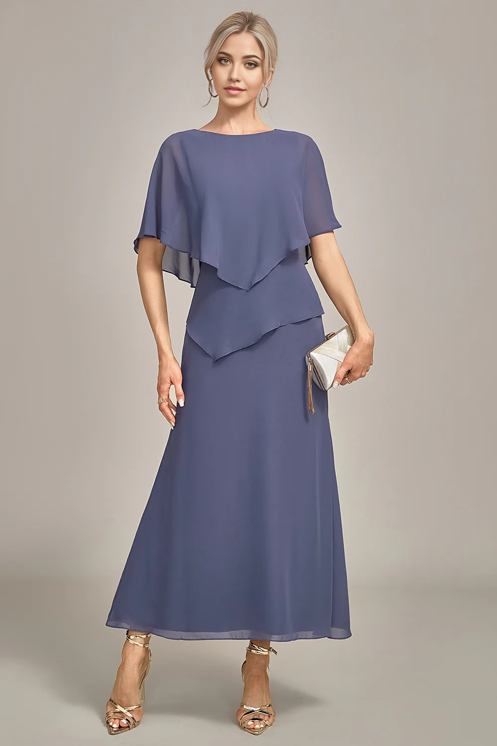 Side profile of woman in flowing tea-length chiffon dress.