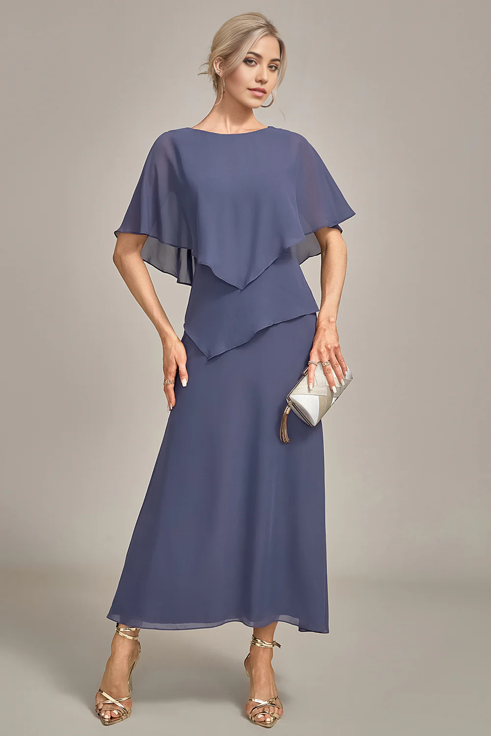 Close-up of the scoop neckline and chiffon fabric of the dress.