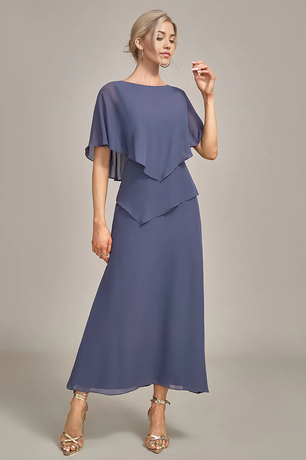Full length view of woman in tea-length Mother of the Bride dress.