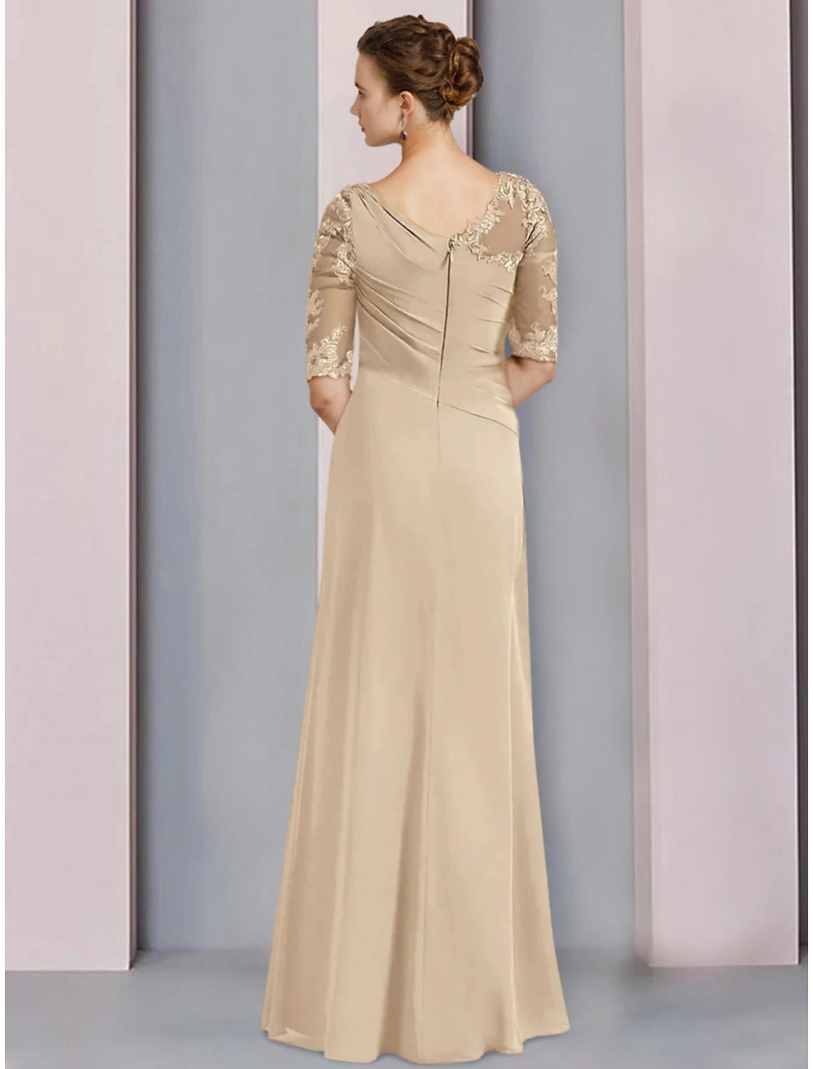 Back view of the floor-length chiffon gown with ruching details.