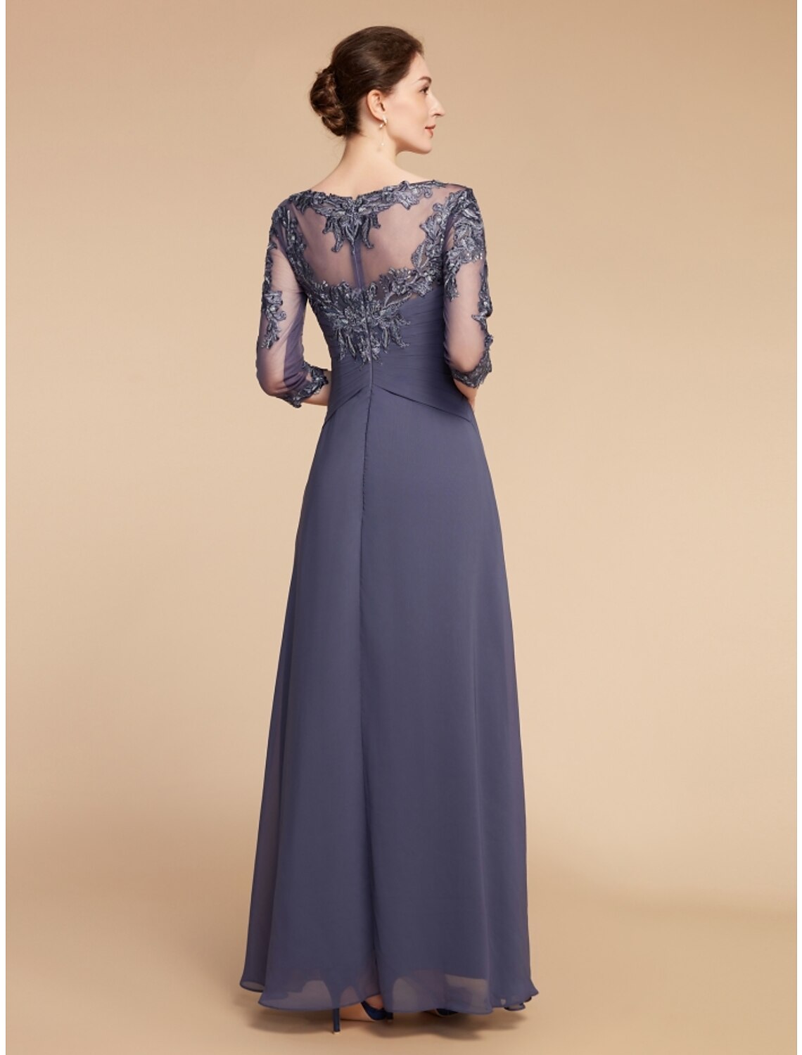 Back view of the ankle-length chiffon and lace wedding guest dress.