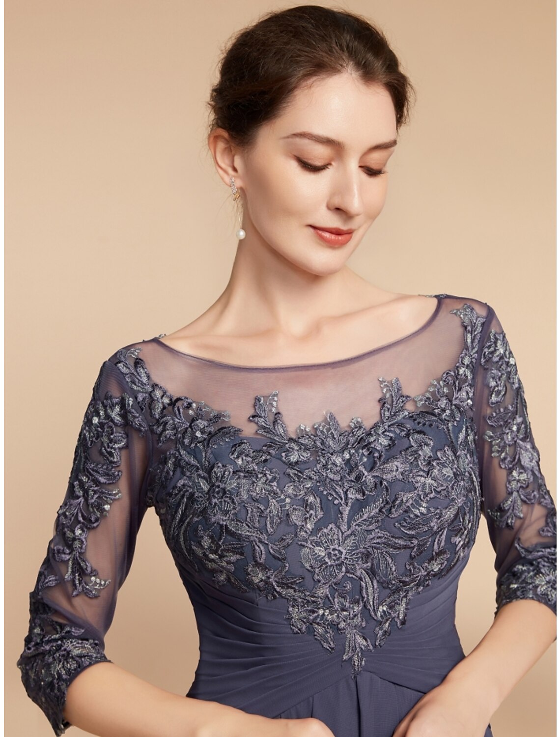 Side profile of the vintage-inspired formal dress with ruching details.