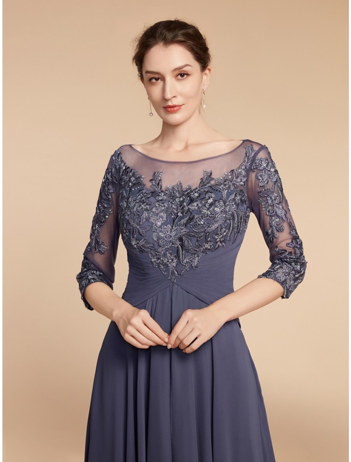 Close-up of the lace and ruffle details on the half sleeve dress.