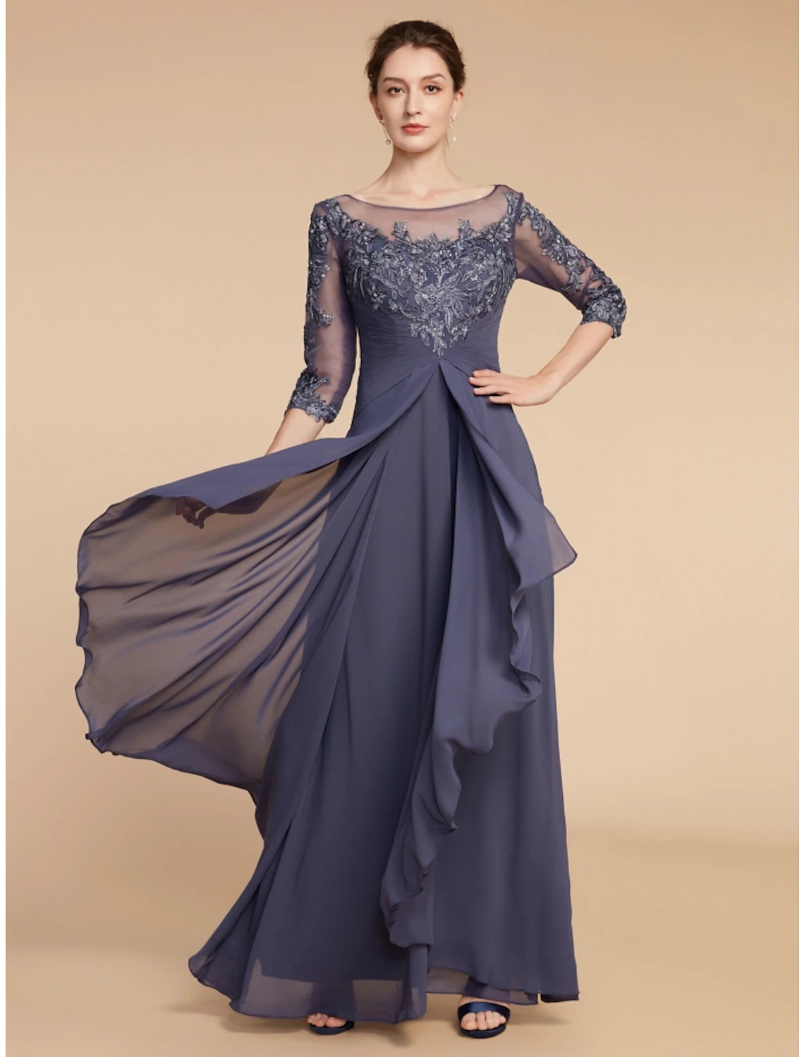 Detailed view of the chiffon fabric and ankle-length hem of the dress.