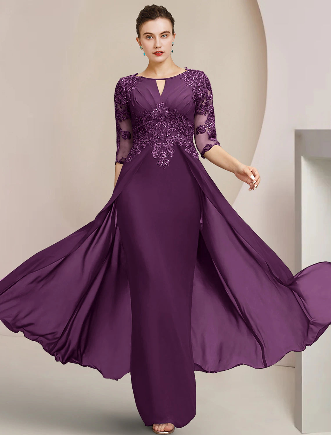 Elegant dark blue sheath gown with scoop neck, half sleeves, lace, and sequin details.
