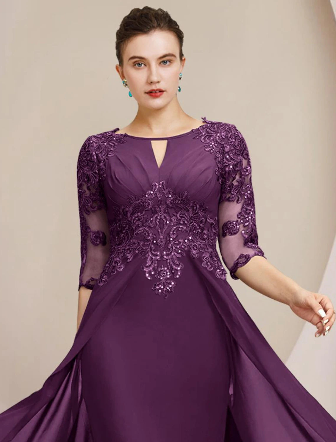 Back view of the floor-length Mother of the Bride dress with delicate lace.
