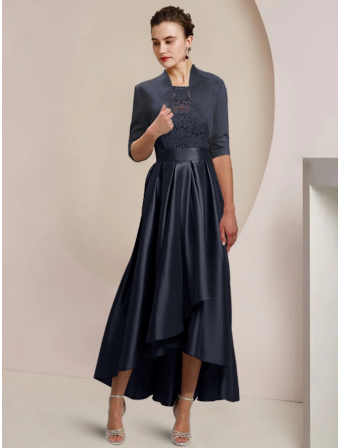 Elegant satin lace sheath dress with scoop neck and half sleeves.