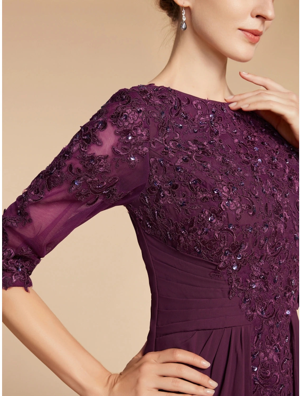 Full view of the elegant mother of the bride dress, showcasing its silhouette.