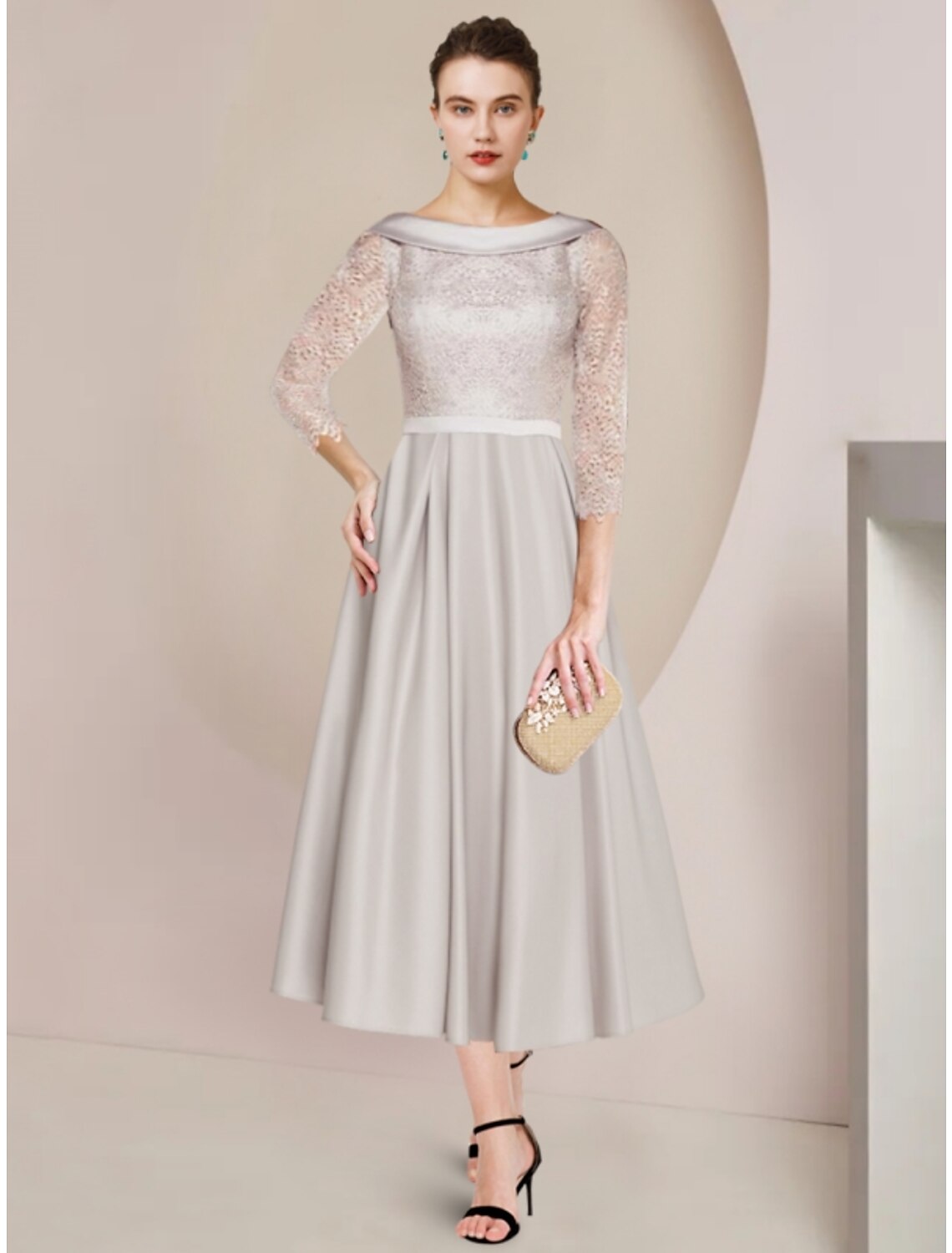 Elegant sheath Mother of the Bride dress with scoop neck and half sleeves, featuring ruching and satin lace fabric.