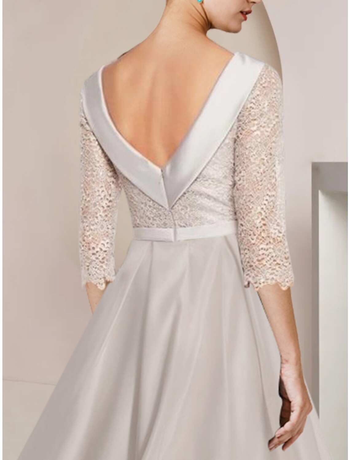 Side view of the Mother of the Bride dress, highlighting the sheath silhouette and ruching.