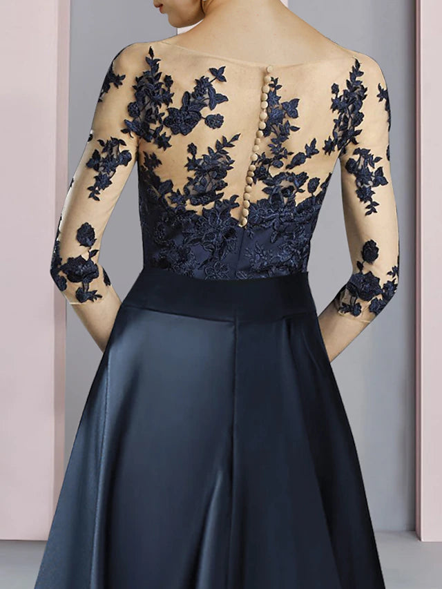 Close-up of the intricate satin and lace fabric on the dress.