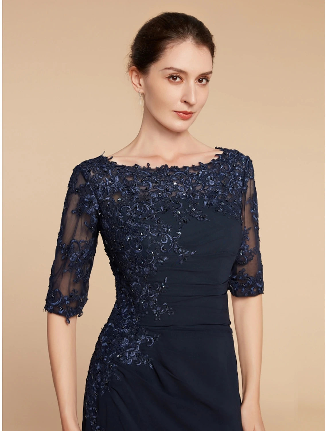 Side view of formal wedding guest gown showing sequin details.