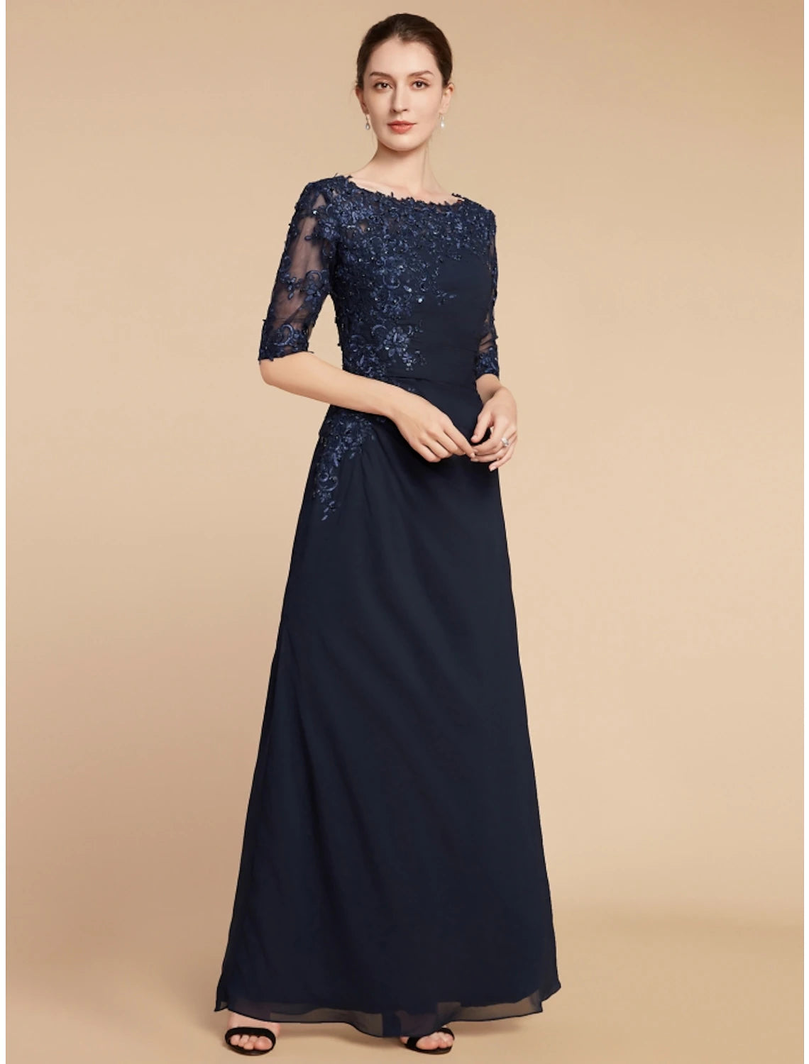 Full length view of a woman wearing an elegant solid color formal dress.