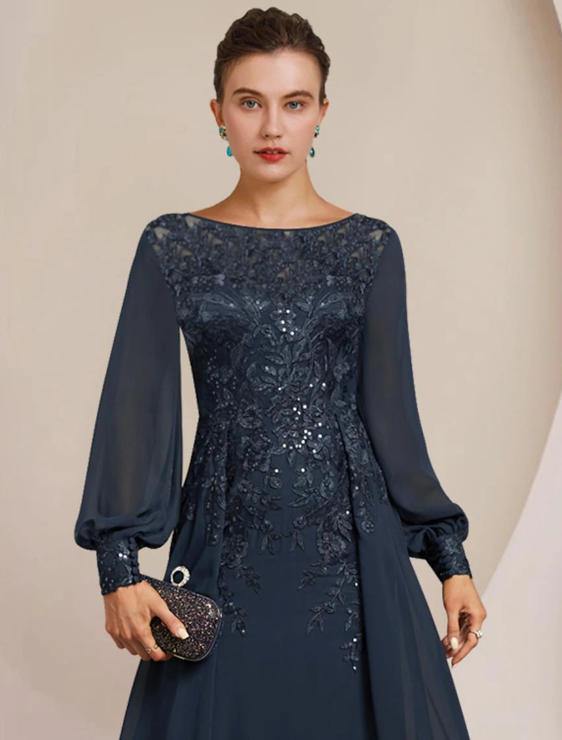 Side view of the elegant sheath mother of the bride gown, showcasing floor length and delicate lace details.