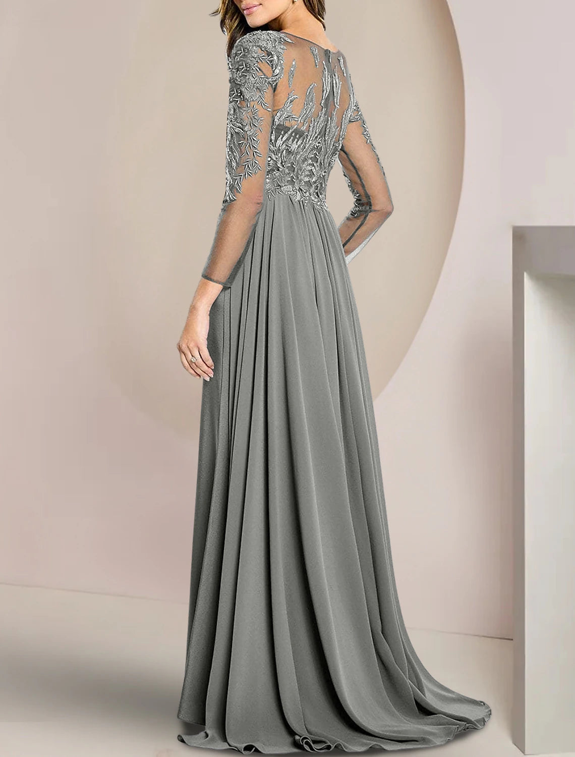 Back view of the elegant floor-length sheath dress with long sleeves.