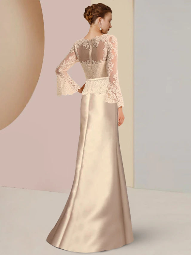 Close-up of the lace and beading appliques on a formal long sleeve gown.