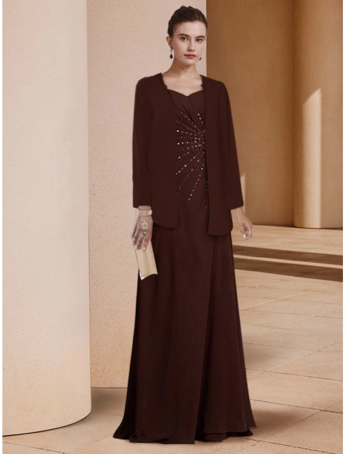 Elegant long sleeve scoop neck sheath dress with sequin and ruching details.