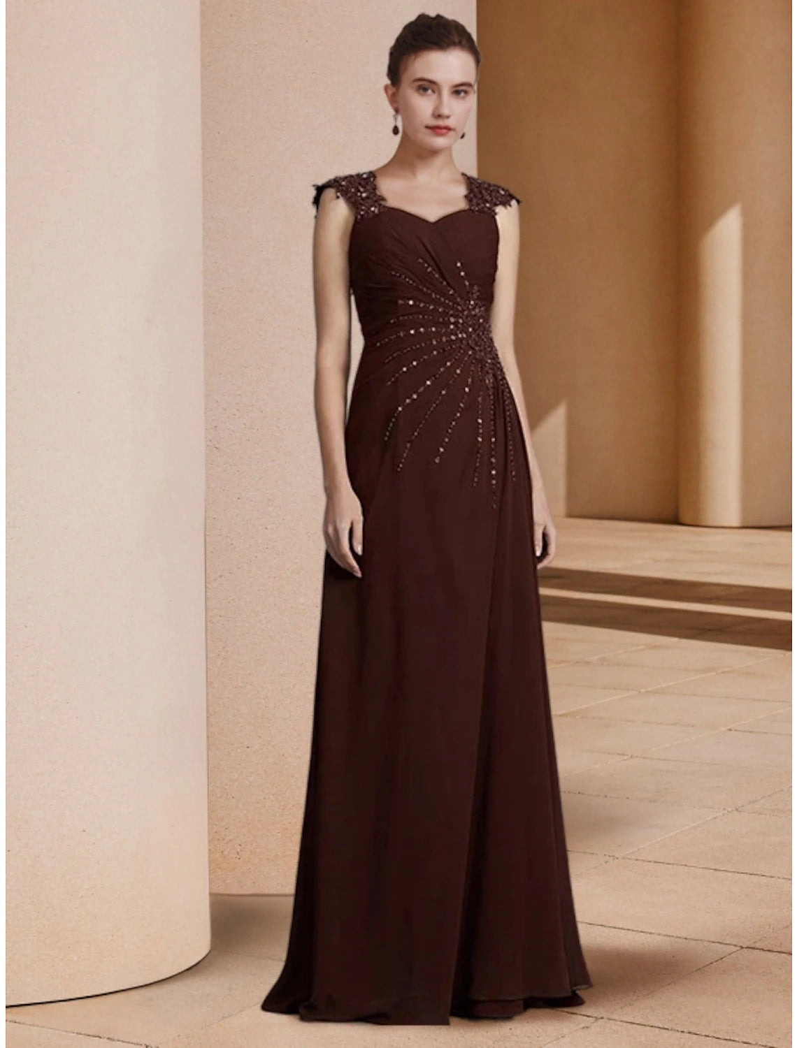 Side view of the elegant long sleeve formal gown.